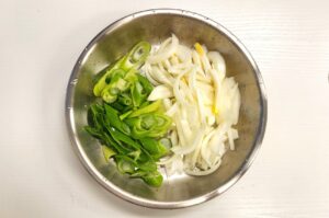 Sliced onion and green onion for dubu jorim