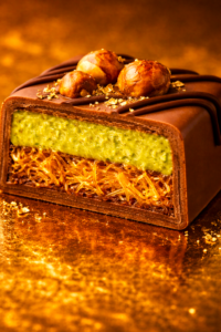 Dubai chocolate pistachio bar cross section showing pistachio cream and kataifi pastry layers inside