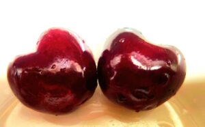 two fresh cherries close up rich in antioxidants and melatonin
