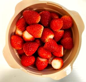 bowl of fresh sliced strawberries healthy diet snack portion control