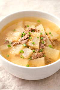 Korean radish soup muguk with beef and green onions