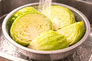 how to wash cabbage under running water in a colander