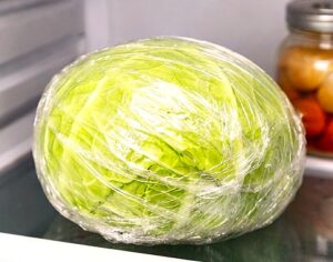 whole cabbage wrapped in plastic stored in refrigerator — how to store cabbage to last 2 months