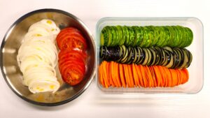 Organic eggplant zucchini tomato onion sliced for microwave steaming
