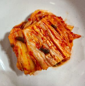Korean kimchi fermented cabbage in a bowl supporting blood sugar regulation