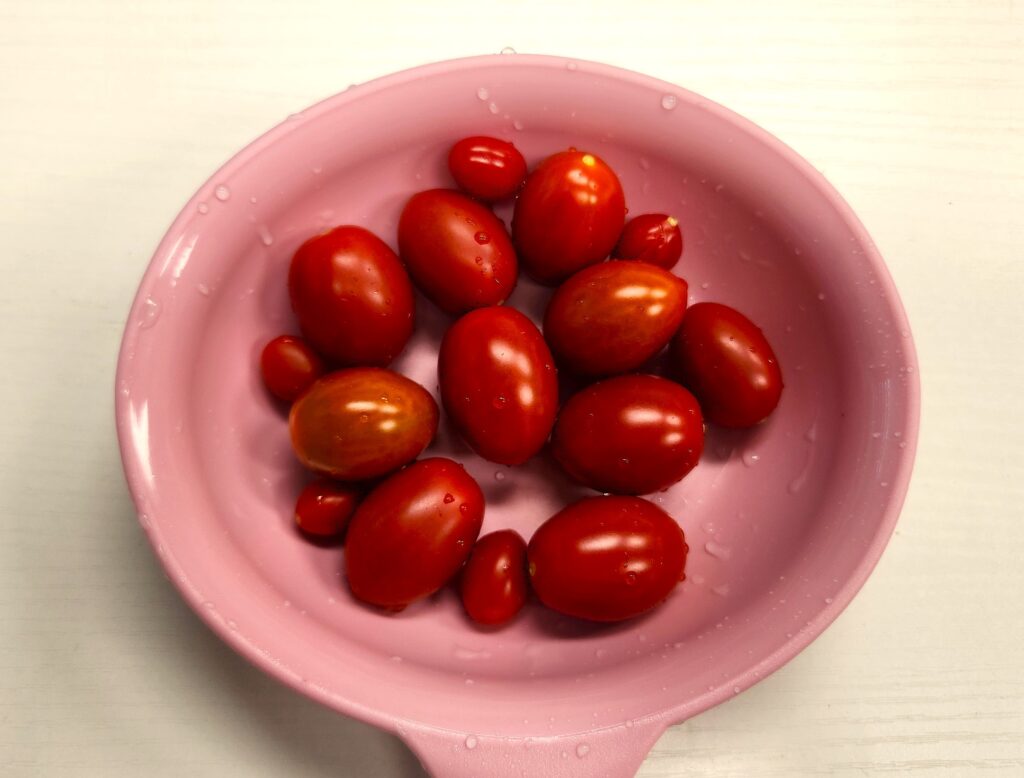 Freshly washed homegrown cherry tomatoes in a bowl